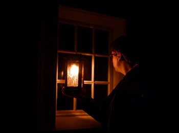 Ghost tour guide with lantern